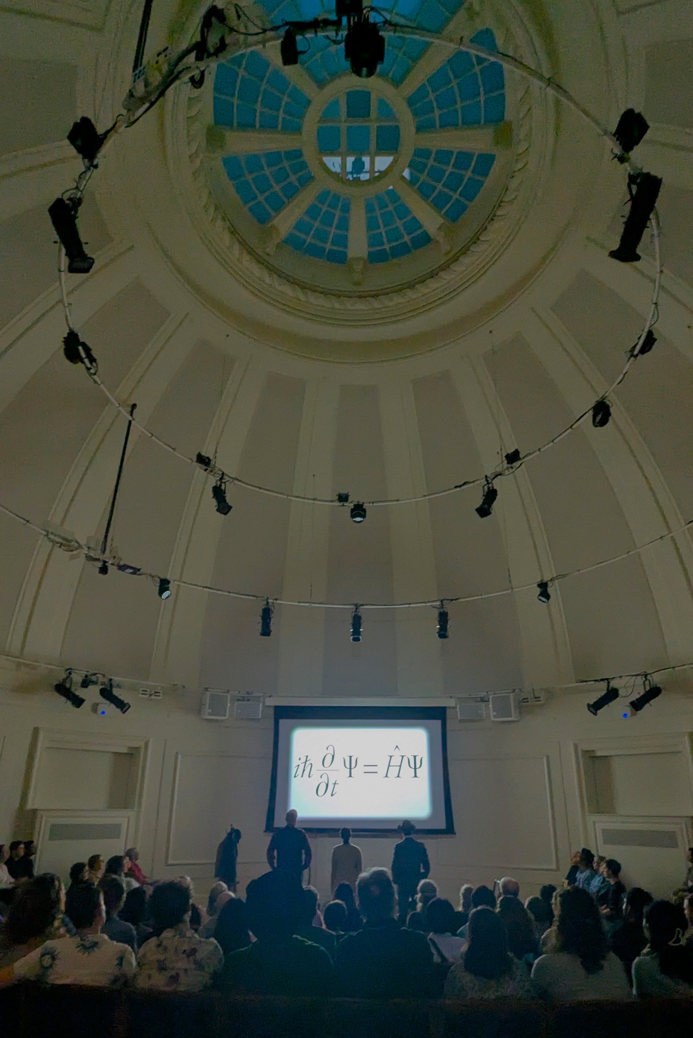 Actors watching at the screen with the audience